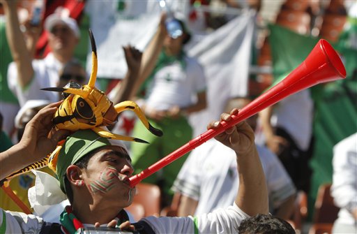 An Algeria fan blows a vuvuzela during the World Cup group C soccer match between Algeria and Slovenia at Peter Mokaba Stadium in Polokwane, South Africa, Sunday, June 13, 2010.  (AP Photo/Martin Mejia) (AP)