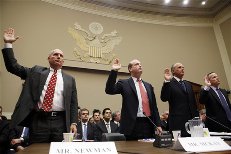From left, Steven Newman, President and Chief Executive Officer Transocean Limited, Lamar McKay, President and Chairman of BP America, Inc., Timothy Probert, President, Global Business Lines, and Chief Health, Safety, and Environmental Officer, Halliburton, and Jack Moore, President and Chief Executive Officer, Cameron, are sworn in before they testify during a House subcommittee hearing on the Gulf Coast oil spill, Wednesday, May 12, 2010, on Capitol Hill in Washington. (AP Photo/Carolyn Kaster) (Carolyn Kaster)