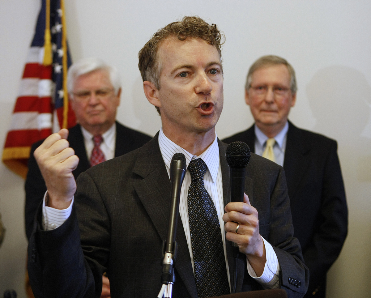 Republican U.S. Senate candidate Rand Paul speaks to supporters during a party unity rally in Frankfort, Ky., Saturday, May 22, 2010. U.S. Senate Minority Leader Mitch McConnell, right, and U.S. Rep. Hal Rogers look on in the background. (AP Photo/Ed Reinke) (Ed Reinke)
