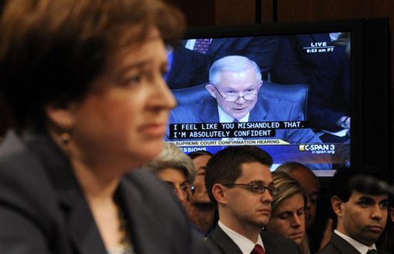 Supreme Court nominee Elena Kagan, foreground. listens to questions from Sen. Jeff Sessions, R-Ala., the ranking Republican on the Senate Judiciary Committee, on video screen, on Capitol Hill in Washington, Tuesday, June 29, 2010, during the committee's confirmation hearing for Kagan. (AP Photo/Susan Walsh) (Susan Walsh)