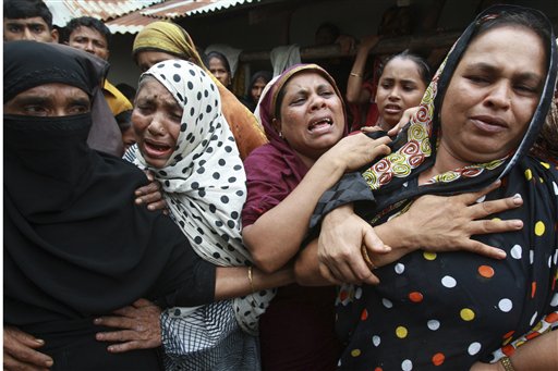 Bangladeshi women who lost their relatives in landslides react in Ukhia, 296 kilometers (185 miles) south of Dhaka, Bangladesh, Wednesday, June 16, 2010. Triggered by heavy rains, the powerful mudslides struck Tuesday, burying thatched homes and cutting off thousands in southeastern Bangladesh. Dozens of bodies have been recovered as the death toll continues to rise. (AP Photo/Pavel Rahman) (AP)