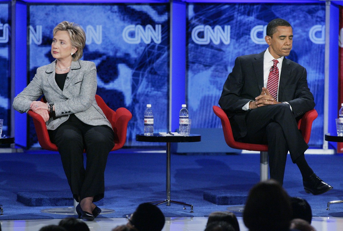 U.S. Senator Hillary Clinton (D-NY) and U.S. Senator Barack Obama (D-IL) sit onstage during the CNN/Nevada Democratic Party debate at the University of Nevada Las Vegas (UNLV) in Las Vegas, Nevada November 15, 2007.  REUTERS/Steve Marcus (UNITED STATES) (Â© Steve Marcus / Reuters)