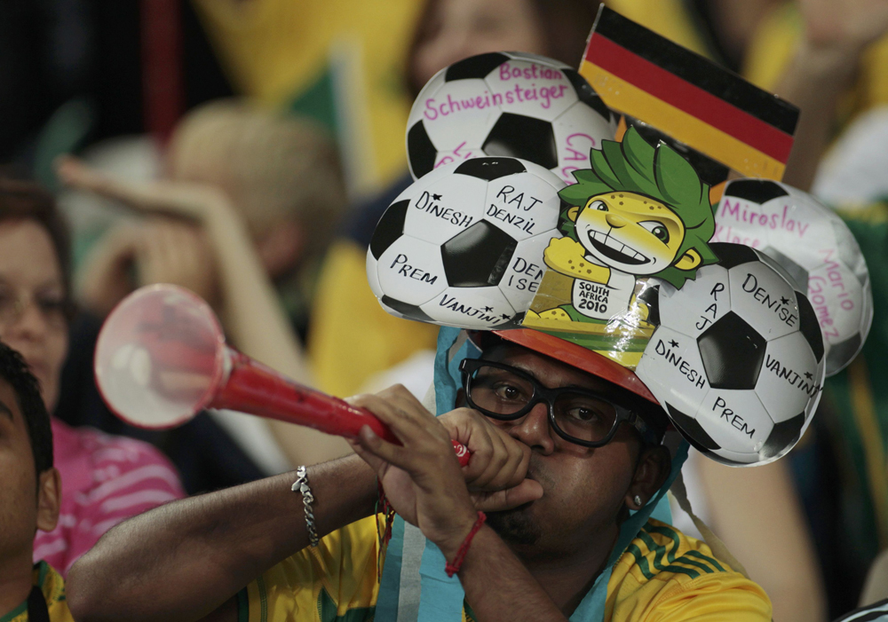 A soccer fan blows the vuvuzela trumpet before the start of the 2010 World Cup Group D soccer match between Germany and Australia at Moses Mabhida stadium in Durban June 13, 2010.  REUTERS/Ina Fassbender (SOUTH AFRICA  - Tags: SPORT SOCCER WORLD CUP) (Â© Ina Fassbender / Reuters)