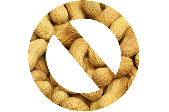 A large group of peanut still in their shells. Selective focus on foreground.