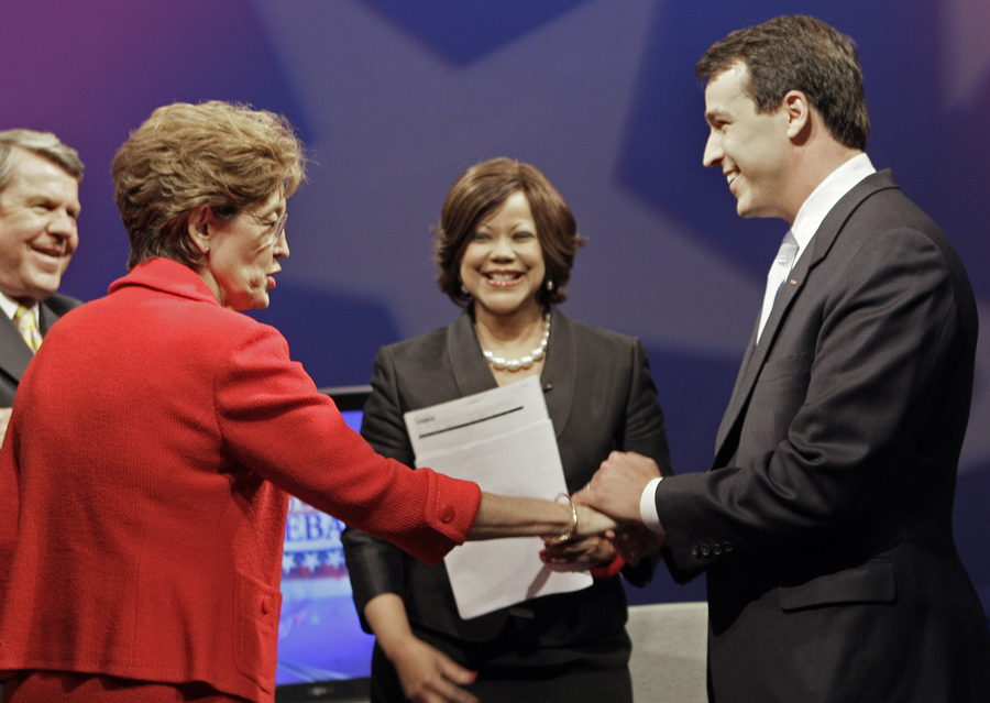 North Carolina Democratic U.S. Senate candidates Elaine Marshall, left, and Cal Cunningham greet each other prior to a televised debate at WRAL-TV in Raleigh, N.C., Thursday, June 10, 2010. Anchors Pam Saulsby, center, and David Crabtree, left, are moderators. (AP Photo/Gerry Broome) (Gerry Broome)