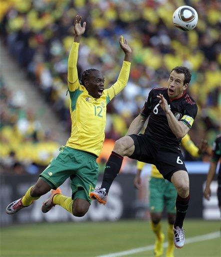 South Africa's Reneilwe Letsholonyane, left, and Mexico's Gerardo Torrado vie for the ball during the World Cup group A soccer match between South Africa and Mexico at Soccer City in Johannesburg, South Africa, on Friday, June 11, 2010. (AP Photo/Themba Hadebe) (AP)