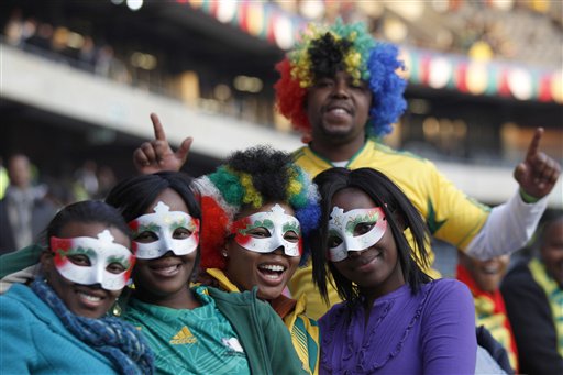 South African soccer fans pose for pictures during the opening concert for the soccer World Cup at Orlando stadium in Soweto, Johannesburg, South Africa, Thursday, June 10, 2010.  The soccer World Cup  will start on Friday, June 11. (AP Photo/Hassan Ammar) (AP)