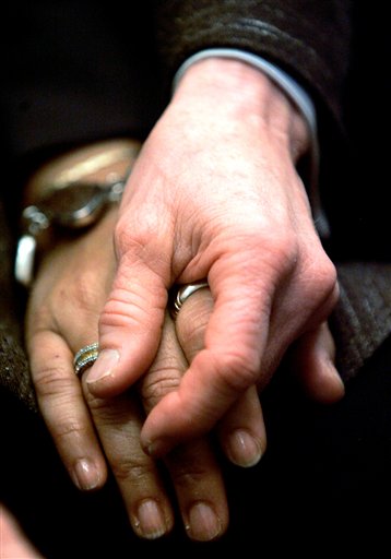 FILE - In this file photo from March 4, 2008, Diane Sabin and her partner Jewelle Gomez hold hands in San Francisco. The lawyers in the landmark federal trial over the constitutionality of California's gay marriage ban may have to check their dazzling oratory at the courtroom door during next week's closing arguments. (AP Photo/Marcio Jose Sanchez, file) (AP)