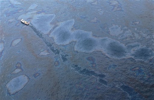 A supply vessel passes through an oil sheen near the site of the Deepwater Horizon oil spill in the Gulf of Mexico near the coast of Louisiana, Monday, May 31, 2010. (AP Photo/Jae C. Hong) (AP)