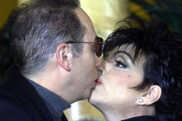 American actress and singing star Liza Minnelli kisses her fiance David Gest at a press conference in London Thursday, Jan. 24, 2002. Minnelli was due to announce her return to the concert stage, with a major European tour that will start at the Royal Albert Hall in London in April 2002. (AP Photo/Dave Caulkin) (Dave Caulkin)
