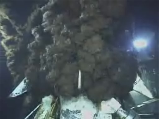 This image from video provided by BP PLC early Thursday morning, June 10, 2010 shows oil continuing to pour out at the site of the Deepwater Horizon oil well in the Gulf of Mexico. The containment cap on the ruptured well is capturing 630,000 gallons a day and pumping it to a ship at the surface. The government has estimated 600,000 to 1.2 million gallons are leaking per day, but a scientist on a task force studying the flow said the actual rate may be between 798,000 gallons and 1.8 million.  (AP Photo/BP PLC) NO SALES (AP)