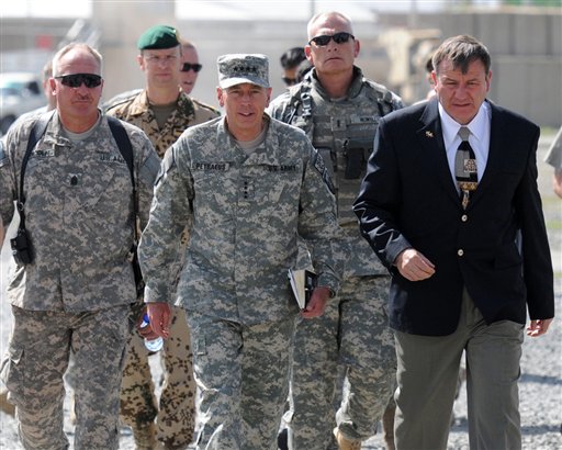 In this photo released by the U.S. Army, Gen. David Petraeus, International Security Assistance Force commander and U.S. Ambassador to Afghanistan Karl Eikenberry walk with other service members after arriving to Camp Phoenix in Kabul for a meeting, July 24, 2010. Petraeus and Eikenberry met with Vice Adm. Robert Harward, Deputy Commander of Detention Operations, Afghan Defense Minister Abdul Rahim Wardak and other officials to talk about the transition of authority of detainee operation centers throughout Afghanistan from U.S. forces to Afghan security forces. (AP Photo/U.S. Army, Sgt. Rebecca Linder) (AP)