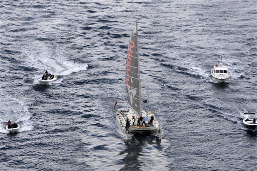 The Plastiki, a boat made out of 12,500 recycled plastic bottles, sails on Sydney Harbour Monday, July 26, 2010, four months after it set out from San Francisco on a journey across the Pacific Ocean meant to raise awareness about the perils of plastic waste. The 60-foot (18.2 meter) catamaran that weathered fierce ocean storms during its 8,000 nautical miles at sea, left San Francisco on March 20, stopping along the way at various South Pacific island nations including Kiribati and Samoa. (AP Photo/Rick Rycroft) (AP)