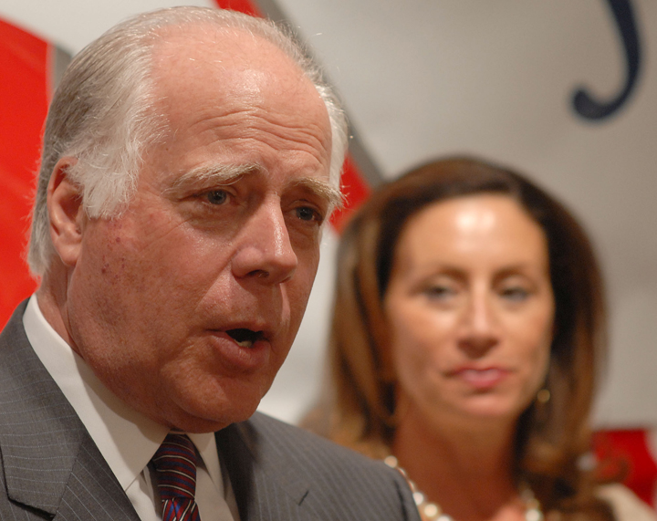 ** FILE ** Republican candidate for the U.S. Senate, John Raese, left, accompanied by his wife Liz, outlines his platform for the Republican party nomination from his campaign office in Charleston, W.Va., Friday, April 7, 2006.  Raese preaches against taxes, government regulation and withdrawing from Iraq, a message that helped him rise above a large Republican field in the May primary.  But the wealthy Morgantown media owner and industrialist has faced an uphill battle in spreading his gospel among the Democratic base of his general election opponent, incumbent Sen. Robert C. Byrd. (AP Photo/Bob Bird, File) (Bob Bird)