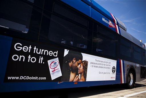 A Washington, D.C. Metro bus displays an advertisement for a female condom, in Washington, Monday, July 26, 2010. To encourage their use, community groups are handing out 500,000 of the female condoms, flexible pouches that are wider than a male condom but similar in length, during instruction sessions at beauty salons, barber shops, churches and restaurants. (AP Photo/Drew Angerer) (AP)