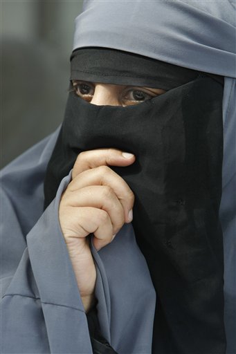 France's Kenza Drider, dressed in a niqab, speaks with reporters during a press conference in Montreuil, east of Paris, Tuesday May 18, 2010. The French government will examine Wednesday,  a proposed bill forbidding burqa-style Islamic veils that cover the face, on the grounds that they do not respect French values or women's dignity.(AP Photo/Remy de la Mauviniere) (AP)