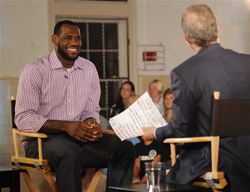 In a photo provided by ESPN, LeBron James sits with Jim Gray before an interview on ESPN on Thursday, July 8, 2010, in Greenwich, Conn. James said that he's decided to join the Miami Heat and leave the Cleveland Cavaliers after an unsuccessful seven-year quest for the championship he covets. (AP Photo/ESPN, Rich Arden) NO SALES (AP)