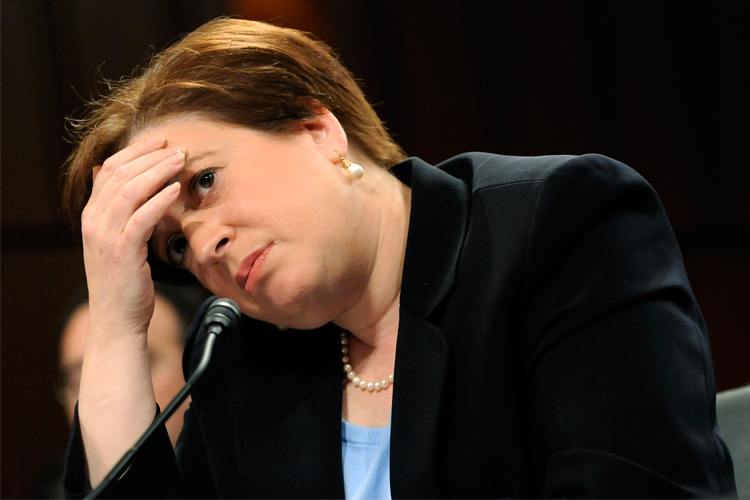 U.S. Supreme Court nominee Elena Kagan rests her head on her hand during testimony on the third day of her Senate confirmation hearing.