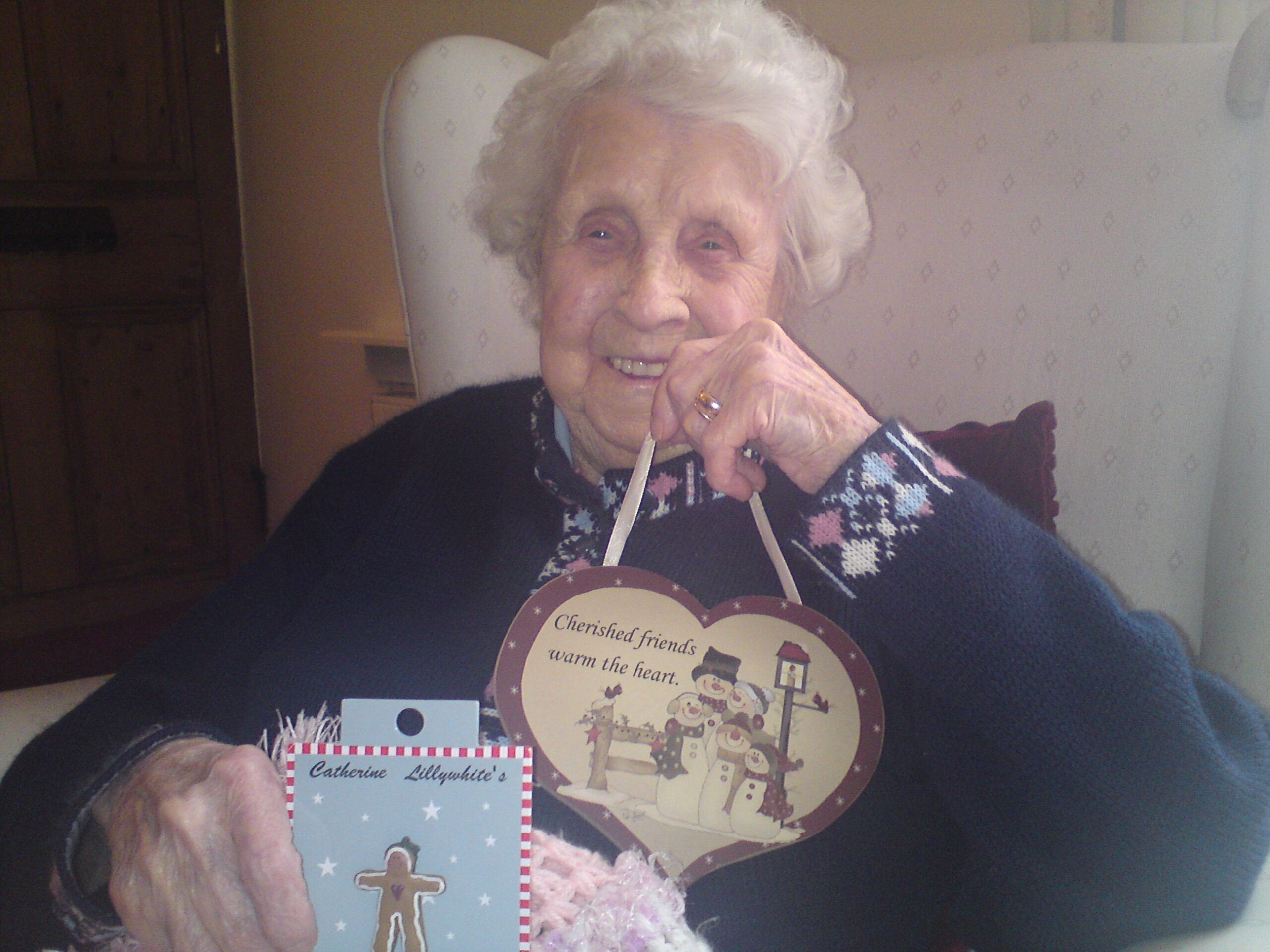 Ivy Bean holds gifts sent to her by a Twitter follower