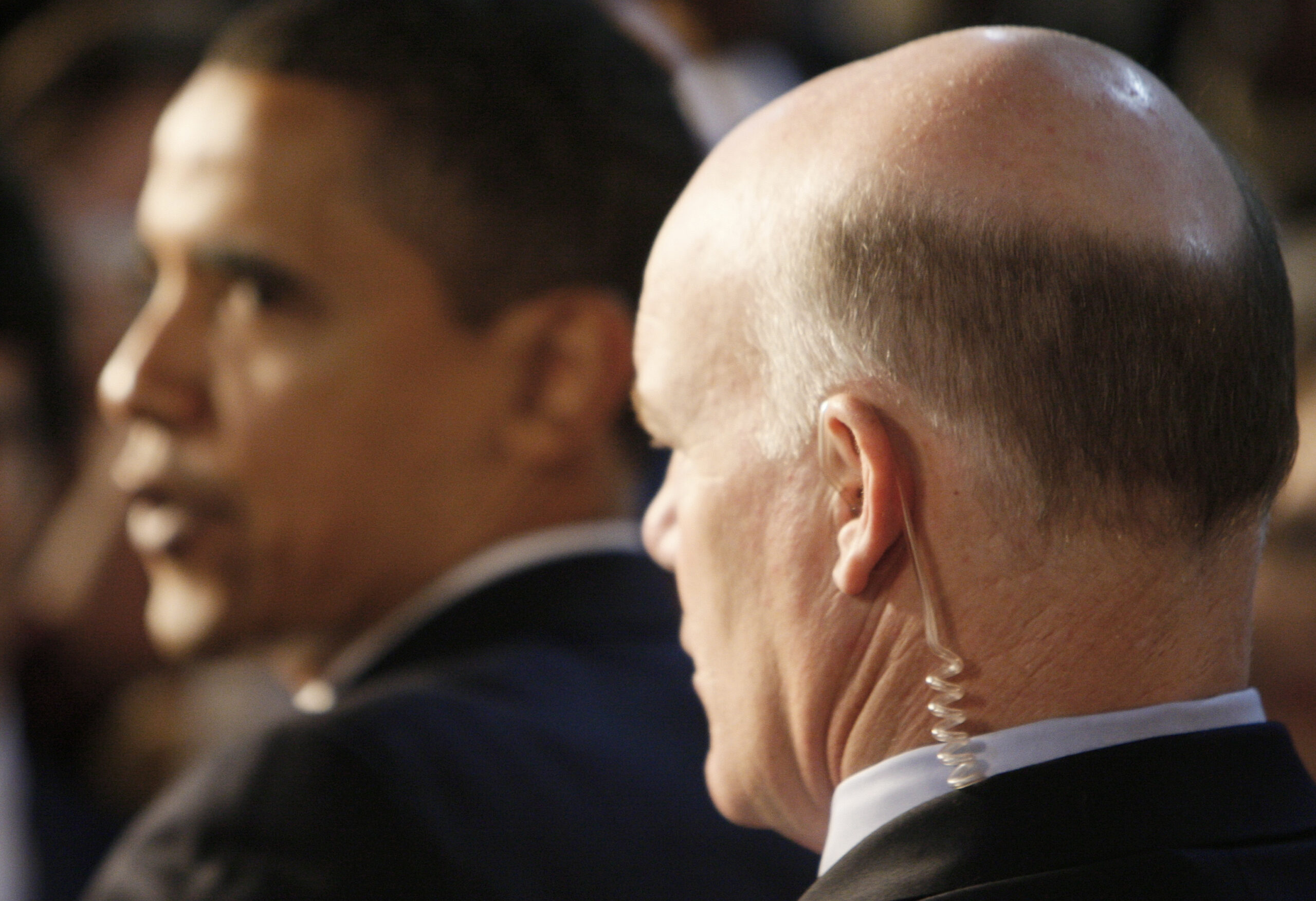 A Secret Service agent stands watch as President Barack Obama greets audience members at a town hall style meeting about the economic stimulus package, Monday, Feb. 9, 2009, at Concord Community High School in Elkhart, Ind. (AP Photo/Charles Dharapak) (Associated Press)