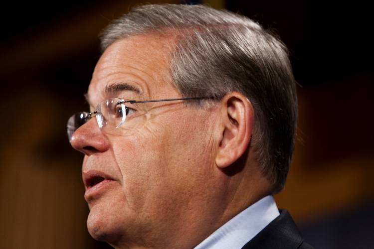 Sen. Robert Menendez, D-N.J., speaks during a news conference on Capitol Hill in Washington, Wednesday, July 14, 2010, to discuss asking the State Department to investigate whether oil giant BP played a role in winning last year's release of the man convicted of the Lockerbie airliner bombing. (AP Photo/Drew Angerer)