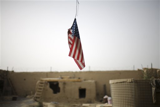 A U.S. flag hangs from the roof of  COP Nolen, in the volatile Arghandab Valley in Kandahar, Afghanistan, Saturday, July 24, 2010. (AP Photo/Rodrigo Abd) (AP)