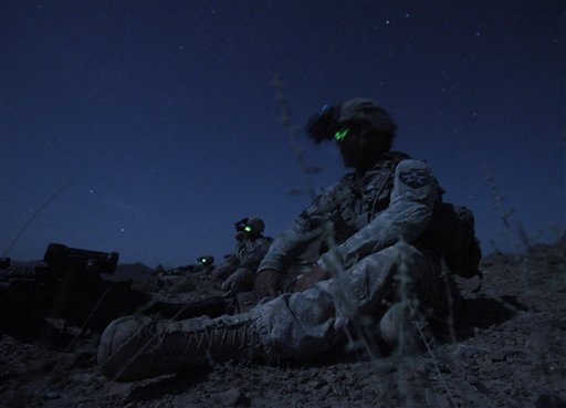 United States Army Spc. Kevin O'Connor, of Hingham, Mass., right, sits in the darkness with other members of  United States Army Spc. Kevin O'Connor, of Hingham, Mass. during an ambush set up Friday, May 21, 2010 to catch Taliban fighters who had fired on their outpost earlier in the week, in Afghanistan's Kandahar province. (AP Photo/Julie Jacobson) (AP)