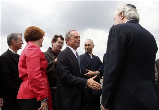 New York City Mayor Michael Bloomberg, center, greets local religious leaders after a news conference in New York, Tuesday, Aug. 3, 2010.  Bloomberg, along with other political and religious leaders, showed their support for a mosque and Islamic cultural center planned in lower Manhattan. (AP Photo/Seth Wenig) (AP)