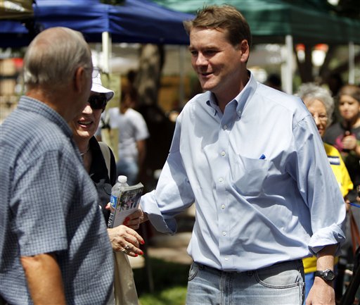U.S. Senator Michael Bennet, right, D-Colo., campaigns in downtown Colorado Springs, Colo., on Monday, Aug. 9, 2010. Bennet is being challenged by former House Speaker Andrew Romanoff for his seat in the U.S. Senate in Tuesday's primary election. (AP Photo/Ed Andrieski) (AP)