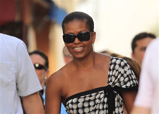 U.S. First Lady Michelle Obama smiles while she visits Marbella, southern Spain, Wednesday, Aug. 4, 2010. The White House says first lady Michelle Obama is in Spain for a private trip with longtime family friends. (AP Photo/Sergio Torres) (AP)