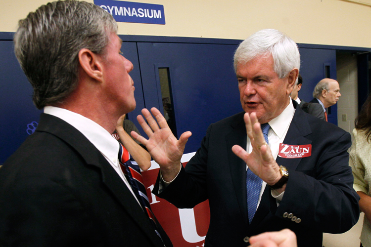 Newt Gingrich, right, talks with Iowa Republican Congressional candidate Brad Zaun after speaking at a fundraising breakfast for Zaun on July 12 in Des Moines.
