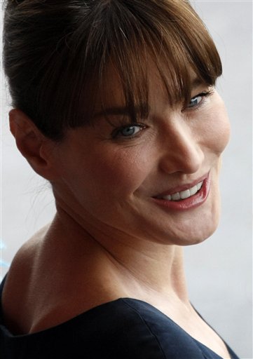 FILE - In this Wednesday, July 14, 2010 file photo, French President Nicolas Sarkozy's wife Carla Bruni-Sarkozy attends the annual Bastille Day military parade on The Champs Elysee Avenue in Paris, France. Iran's hardline media have called the French first lady a "prostitute" after she expressed strong support for an Iranian woman facing death by stoning for adultery. (AP Photo/Francois Mori, File) (AP)