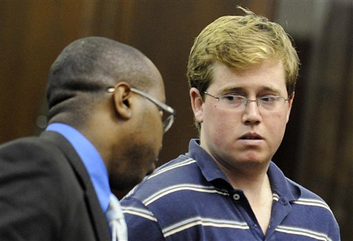 ** RETRANSMISSION OF NYR103 FOR ALTERNATE CROP ** Michael Enright, right, confers with his attorney Jason Martin, during his arraignment in a New York City courtroom on charges that include attempted murder as a hate crime, Wednesday, Aug. 25, 2010. Enright is accused of slashing taxi driver Ahmed H. Sharif with a hand tool on Tuesday, Aug. 24, after the driver said he was Muslim. (AP Photo/Steven Hirsch, Pool) (AP)