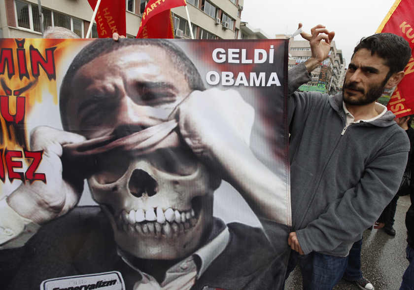 Demonstrators hold an anti-U.S. President Barack Obama poster during protests in downtown Ankara April 6, 2009. Obama is visiting Turkey on the last leg of an eight-day trip that marks his debut as president on the world stage, is a recognition of the secular but predominantly Muslim country's growing clout and Washington's desire for its help to solve confrontations and conflicts from Iran to Afghanistan. REUTERS/Pawel Kopczynski (TURKEY POLITICS CONFLICT) (Â© Pawel Kopczynski / Reuters)