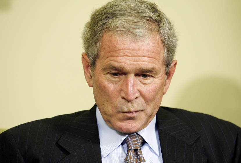U.S. President George W. Bush looks down during his meeting with Slovak President  Ivan Gasparovic in the Oval Office of the White House in Washington October 9, 2008. 
REUTERS/Kevin Lamarque   (UNITED STATES) (Â© Kevin Lamarque / Reuters)