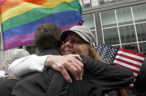 Sheree Red Bornand, right, hugs Aidan Dunn after hearing the decision in the United States District Court proceedings challenging Proposition 8 outside of the Phillip Burton Federal Building in San Francisco, Wednesday, Aug. 4, 2010. A person close to the case says a federal judge has overturned California's same-sex marriage ban in a landmark case that could eventually land before the U.S. Supreme Court. Chief U.S. District Judge Vaughn Walker made his ruling Wednesday in a lawsuit filed by two gay couples who claimed the voter-approved ban violated their civil rights. (AP Photo/Jeff Chiu) (AP)