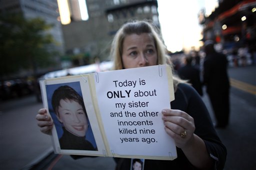 Alyson Low, of Fayetteville, Ark., holds a photo of her sister Sara Low as friends and relatives of the victims of the Sept. 11, 2001 attacks gather for a commemoration ceremony at Zuccotti Park, adjacent to ground zero, on the ninth anniversary of the terrorist attacks on the World Trade Center, Saturday, Sept. 11, 2010 in New York. (AP Photo/Jason DeCrow) (AP)