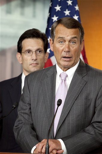 FILE - In this April 5, 2010 file photo, House Minority Leader John Boehner of Ohio, right, accompanied by House Minority Whip Eric Cantor of Va., speaks on Capitol Hill in Washington. Boehner could walk down most U.S. streets anonymously. But the perpetually tanned golf lover, who grew up in a Cincinnati family of 14, could become the next House speaker and the GOP leader of opposition to President Barack Obama.  (AP Photo/Harry Hamburg, File) (AP)