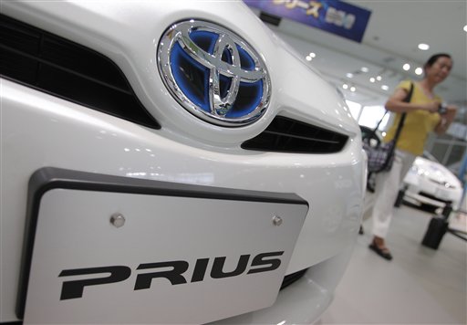 File - In this July 6, 2010 file photo, Prius hybrid vehicles are displayed at Toyota Motor Corp.'s showroom in Tokyo. Toyota's Prius is becoming a little less quiet with a new electronic humming device that is the automaker's answer to complaints that pedestrians can't hear the top-selling car approaching. The 12,600 yen ($148) speaker system that goes under the hood of the third-generation Prius sets off a whirring sound designed to be about the same noise level as a regular car engine so that it isn't annoying, Toyota said Tuesday, Aug. 24, 2010. (AP Photo/Itsuo Inouye, File) (AP)