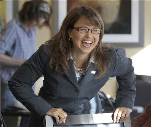 Delaware Republican Senate candidate Christine O'Donnell laughs while talking with family members in between television interviews, Wednesday, Sept. 15, 2010, in Dover, Del. O'Donnell defeated Rep. Mike Castle, R-Del., in Tuesday's primary. (AP Photo/Rob Carr) (AP)