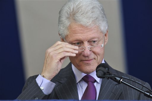 Former President Bill Clinton adjusts his glasses as he delivers the Yale Class Day Address at Yale University in New Haven, Conn., Sunday, May 23, 2010.  (AP Photo/Jessica Hill) (AP)