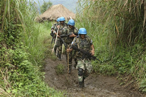 United Nations peacekeepers patrol near their encampment in the village of Kimua, deep in the heart of territory controlled by Rwandan Hutu rebels, in eastern Congo. (AP/Rebecca Blackwell)