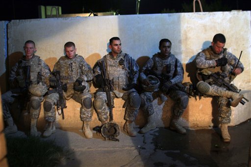 US Army soldiers from 1st Battalion, 14th Infantry Regiment sit in a courtyard outside an Iraqi police station during a joint operation with Iraqi security forces on the first day after America ended its combat role, Wednesday, Sept. 1, 2010 in Hawija, north of Baghdad, Iraq.  The U.S. marks on Wednesday the transition to the final phase of the Iraq war, shifting the focus of the remaining 50,000 American troops from combat operations to preparing Iraqi security forces to protect the country on their own. (AP Photo/Maya Alleruzzo) (AP)