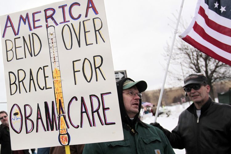A Tea Party member carries a sign voicing his concern over "ObamaCare" during a rally marking the one-year anniversary of the movement in Troy, Michigan February 27, 2010. Some Tea Partiers say they can pinpoint the precise moment when they made it clear to the Republican Party they had no intention of being its lapdog. On a bright, brisk afternoon in mid-February, with snow still thick on the ground from storms that had battered Washington the week before, Republican National Committee Chairman Michael Steele met with more than 50 members of the Tea Party, the Twitter Age conservative movement that is reshaping the U.S. political landscape. Picture taken February 27, 2010. To match Special Report USA-POLITICS/TEAPARTY. REUTERS/Rebecca Cook  (UNITED STATES - Tags: POLITICS CIVIL UNREST) (Â© Rebecca Cook / Reuters)