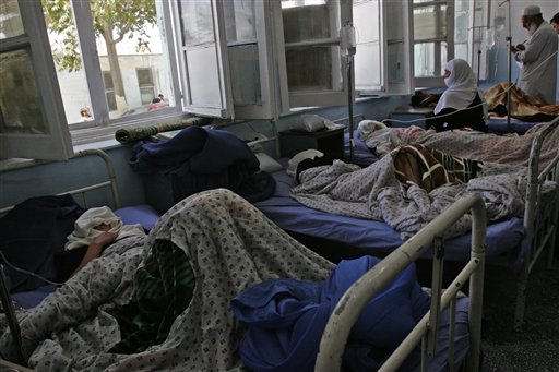 Afghan schoolgirls rest at a hospital in Ghazni, eastern Afghanistan, Saturday, June 12, 2010. More than three dozen school girls were hospitalized after becoming ill from suspected poisoning at their high school in Ghazni. There have been similar cases of illnesses at schools around Afghanistan. Some suspect militants are spraying schools with poison gas because they oppose education for girls. (AP Photo/Rahmatullah Naikzad) (AP)