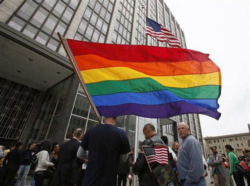 In this photo taken Aug. 4, 2010, same-sex marriage supporters gather outside a federal building and wait for a judge's decision overturning California's same-sex marriage ban in San Francisco. A federal appeals court put same-sex weddings in California on hold indefinitely Monday, Aug. 16, 2010, while it considers the constitutionality of the state's gay marriage ban. (AP Photo/Eric Risberg) (AP)
