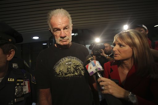 Pastor Terry Jones is surrounded by reporters as he arrives at Laguardia airport, Friday, Sept. 10, 2010 in New York.  (AP Photo/Mary Altaffer) (AP)