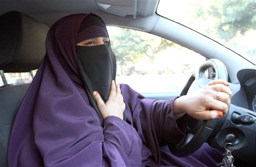 France's Kenza Drider , wearing a niqab,  drives a car  in Avignon, southern France, Monday, Sept. 13, 2010.   A ban on the burqa-style veil, to be voted on Tuesday in the Senate, would affect only a tiny minority of Muslim women _ estimated at less than 2,000 _ making it far less controversial than France's 2004 ban on Muslim headscarves in classrooms, which proliferated in heavily immigrant neighborhoods. (AP Photo/Claude Paris) (AP)