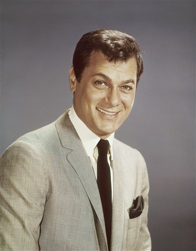 FILE - Actor Tony Curtis is shown in this 1965 file photo. Curtis, whose real name was Bernard Schwartz, was perhaps most known for his comedic turn in Billy Wilder's 'Some Like It Hot' with co-stars Marilyn Monroe and Jack Lemmon has died at 85 according to the Clark County, Nev. coroner. (AP Photo, File) (AP)
