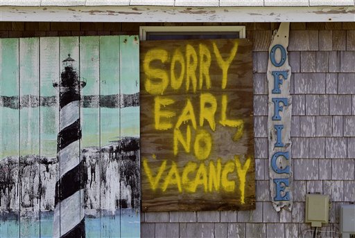 A window is boarded up with a message at the Buxton Beach Motel in Buxton, N.C., Wednesday, Sept. 1, 2010 as Hurricane Earl approaches North Carolina's Outer Banks. (AP Photo/Gerry Broome) (AP)